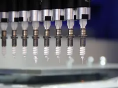 Anlage zur Beschichtung von Wärmeleitpaste Bauteil umspritzt